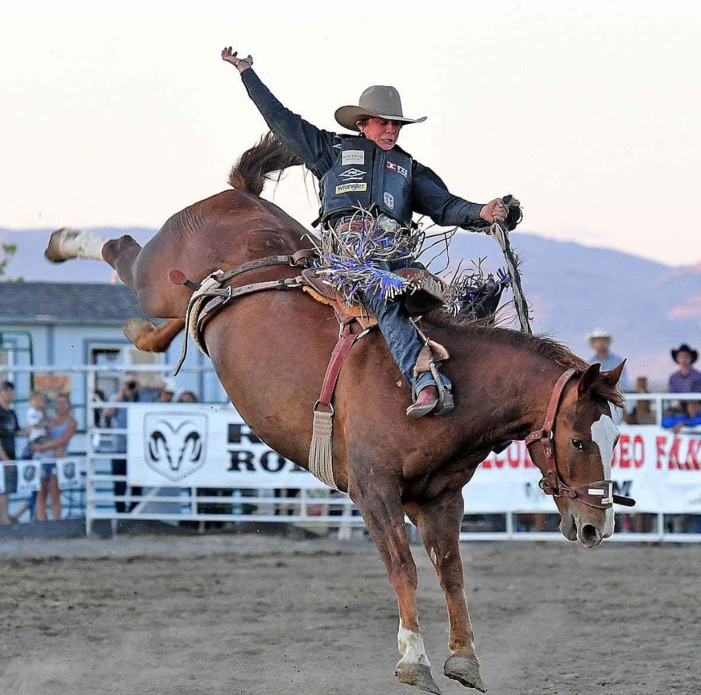 A saddle bronc rider competing at the Daniel Dopps Memorial Rodeo