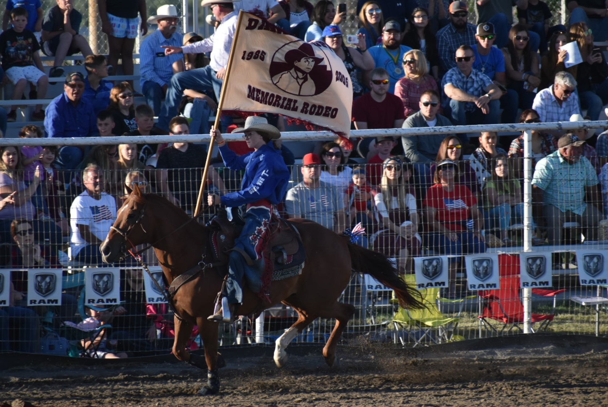 Daniel Dopps Memorial Rodeo flag bearer entering the arena